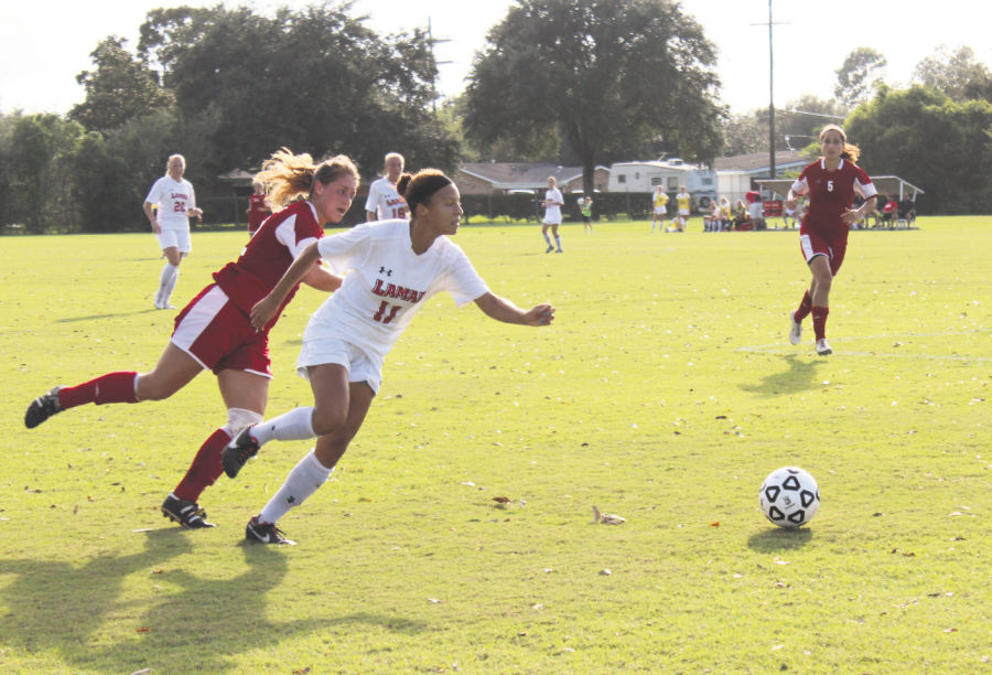 Kirsten Cunningham, #22 from Virginia Beach, Va. about to steal the ball from Lamar player #11 at the Nicholls vs. Lamar soccer game on Oct. 4, 2013.