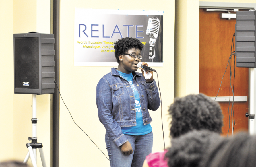 Olabisi Akingbola sings a song and recites a poem at RELATE on Oct. 3, 2013.