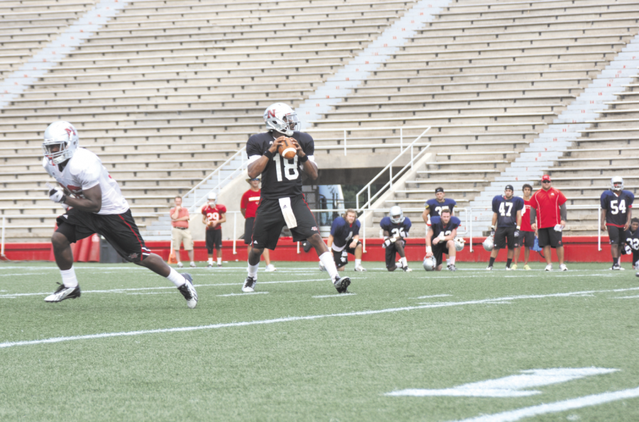 Kalen Henderson, #18, a quarterback for the Nicholls footbal team, prepares to throw the ball to a teammate during a practice drill in Guidry Stadium. 