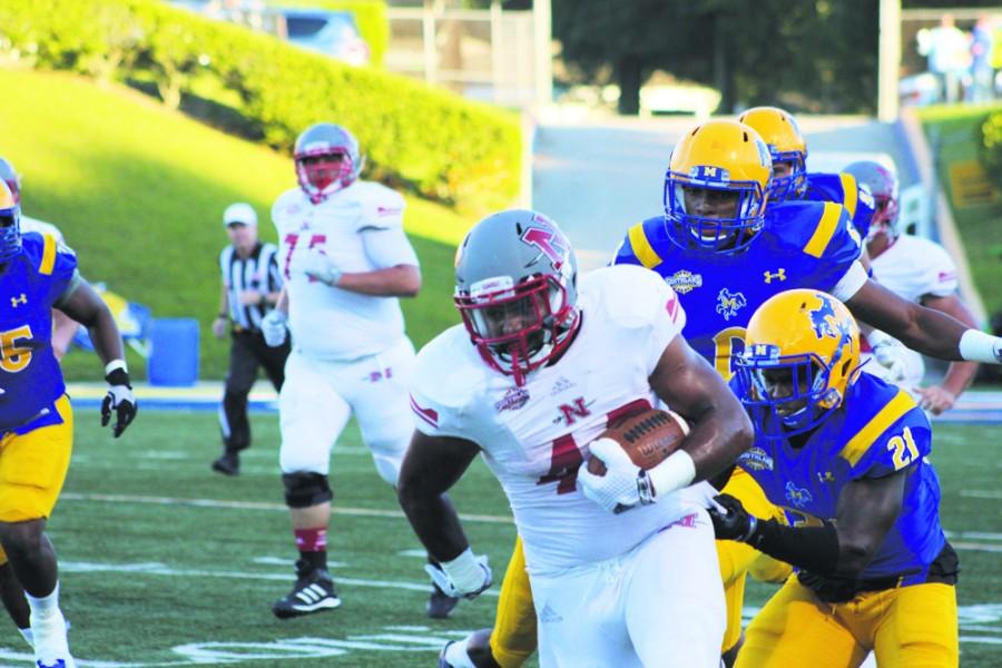 Nicholls runningback Mike Henry, #40, runs away from the McNeese State defense during the Colonels’ game against the Cowboys on Oct. 4. 