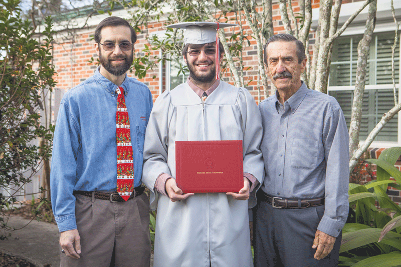 James Rodrigue II (middle) shows off his associate’s degree from Nicholls State University which he obtained before graduating from high school. Nicholls University registrar Kelly Rodrigue (left) and James Rodrigue (right), James II’s grandfather, also graduated from Nicholls.