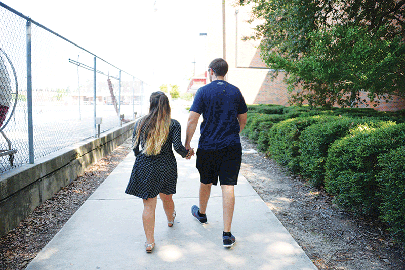 Toni Kliebert, Nursing sophomore from Thibodaux, and Ryan Daigle, Accounting sophomore from Labadieville, walk through campus after class on a Tuesday afternoon.