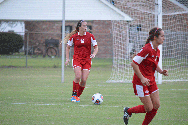 Nicholls sophomore Katherine Kelly, 16, dribbles the ball while Nicholls junior Hannah Savoie, 2, runs down the field during their game against Southeastern Louisiana University on Friday, Oct. 30th.