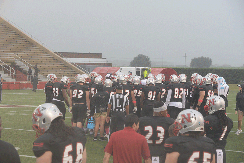 Nicholls football team huddles up during the stormy game against Northwestern Saturday, October 31st.