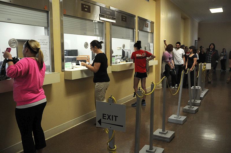 Students line up at Fee Collection in Elkins Hall to pay off any remaining fees before classes resume for the Spring. 