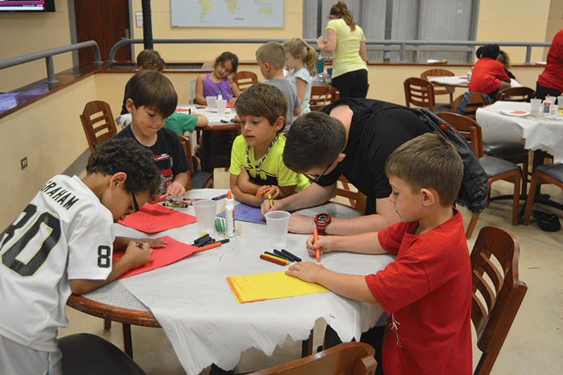 Colonel Campers doing arts and crafts yesterday in the Student Union.