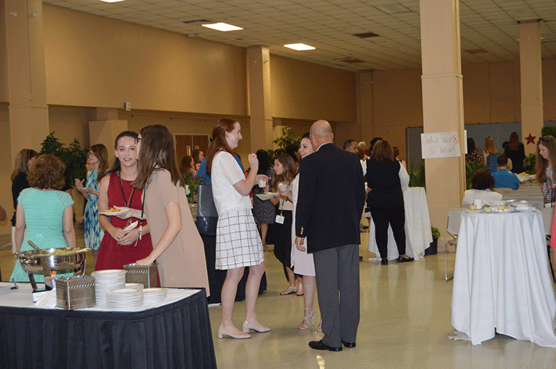 Guests socialize at the Louisiana Girl’s Leadership Academy’s closing ceremony reception on June 15, 2016.