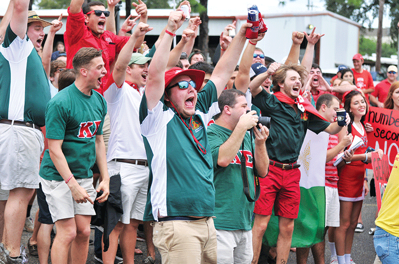 Members of Kappa Sigma fraternity scream with excitement as they accept a new bid on Bid Day September 17th.