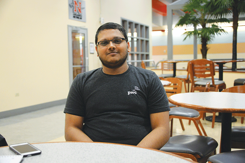Roshan Patel, graduate student in the business administration program, poses for a picture in the union after being interviewed by reporter Claire Blanchard.