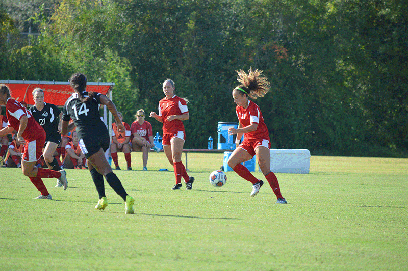 Former Colonel Spencer Valdespino #30, recieves the ball from Kaylie Danirls #3 during the soccer match between Nicholls State University and Abilene Christian University on Friday, September 25, 2015.