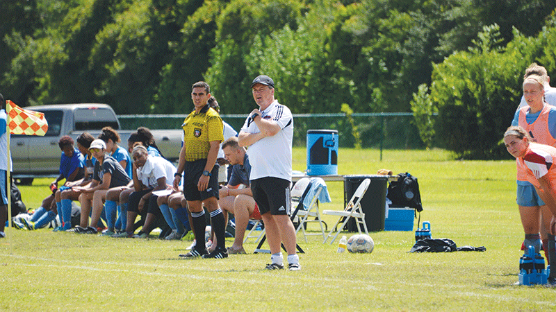 Head Coach McBride watches closely during the Nicholls vs. Southern University soccer game on August 28.