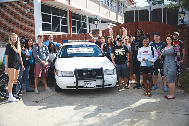about domestic violence issues and statistics. After the presentation students painted their hands purple and placed them on Martinez’s police unit as their commitment to end domestic violence on October 18.