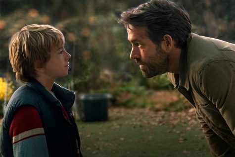 The Adam Project (L to R) Walker Scobell as Young Adam and Ryan Reynolds as Big Adam. Cr. Doane Gregory/Netflix © 2022