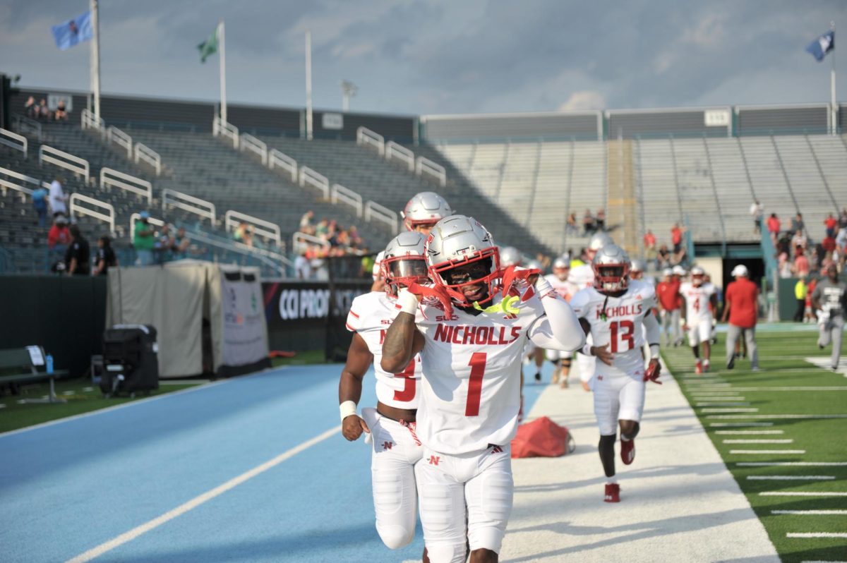 Nicholls receiver Terry Mathews (#1) poses for the camera in pregame warmups before the game against Tulane 