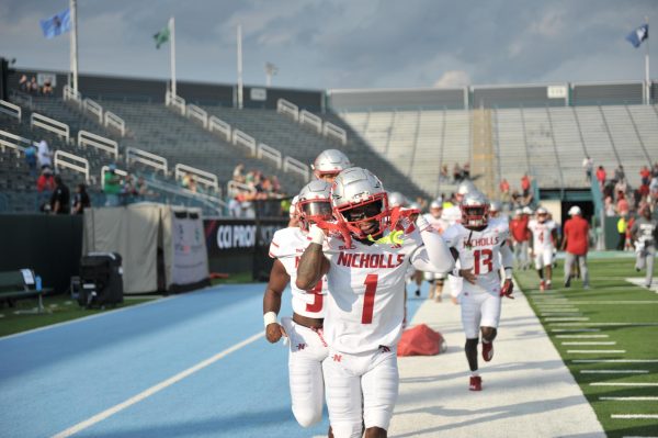 Nicholls receiver Terry Mathews (#1) poses for the camera in pregame warmups before the game against Tulane 
