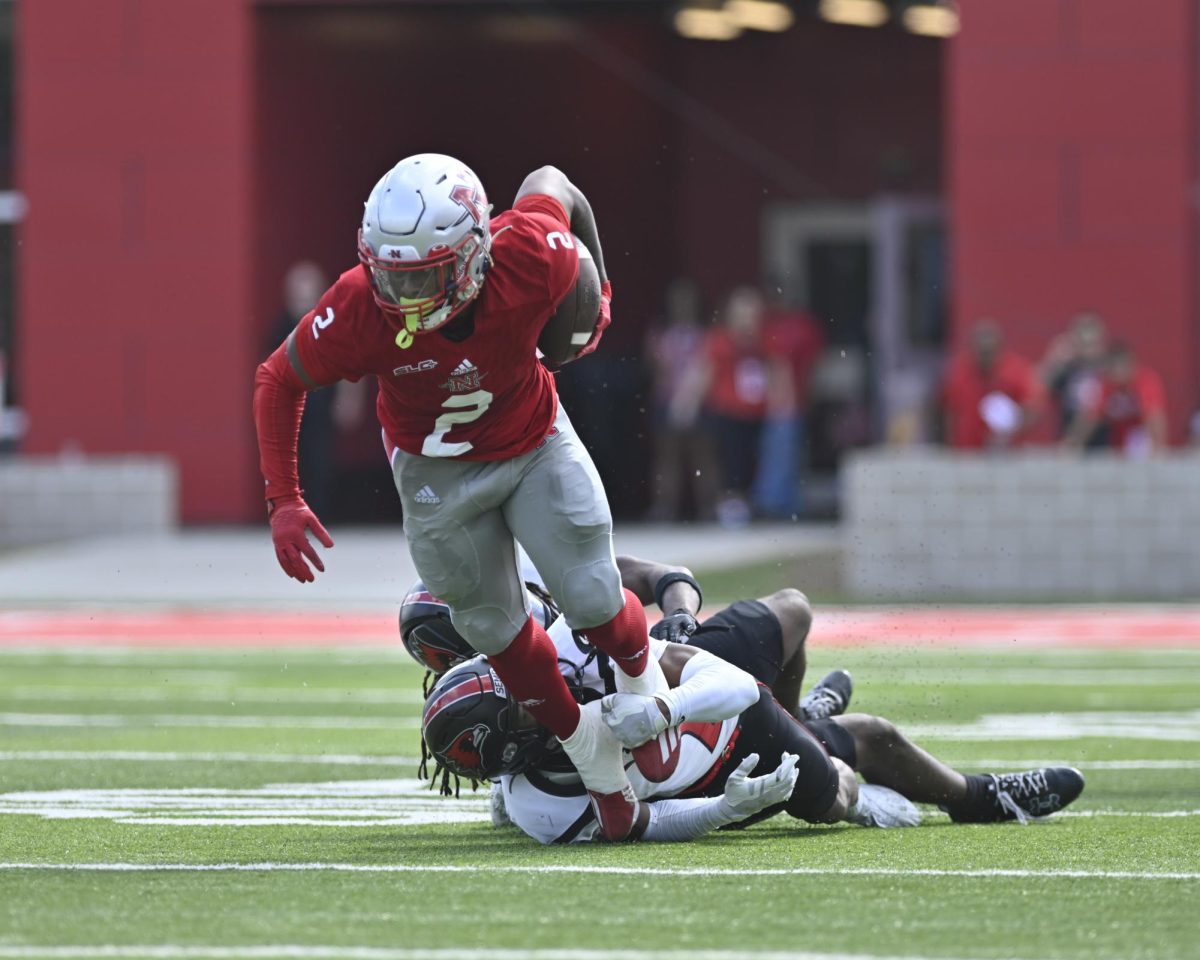 Running back Jaylon Spears (#2) running through a tackle against SEMO