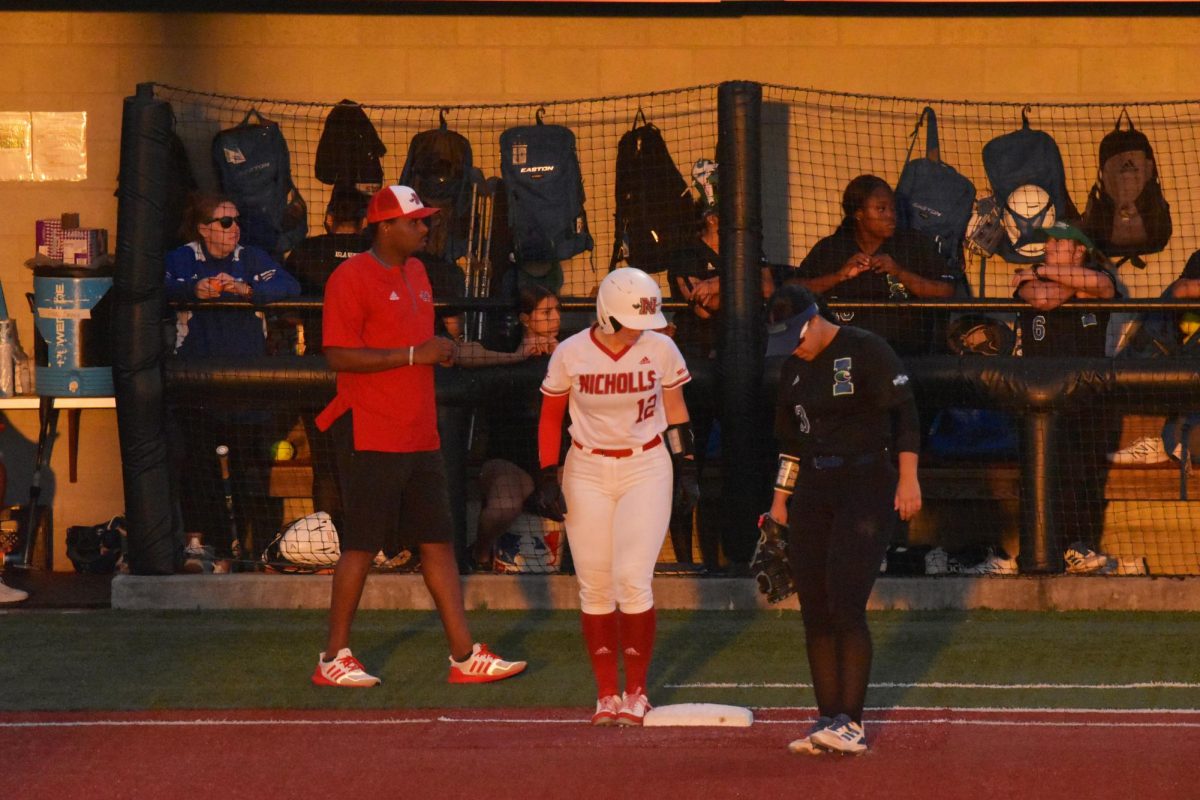 Nicholls catcher Riley Rutherford (#12) stands on first base after reaching on a fielding error in the fifth inning. Rutherford went on to hit a go ahead home run in the following inning.