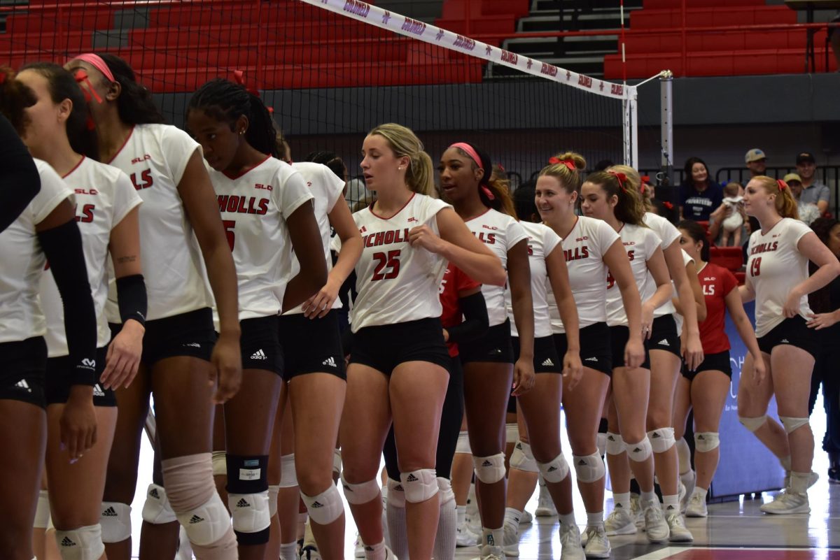 Nicholls shakes hand with UNO players after a win at Stopher Gymnasium (10/3).