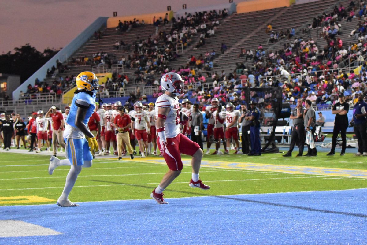 Nicholls running back Collin Guggenheim[#19] high steps into the end zone against Southern University(10/5)