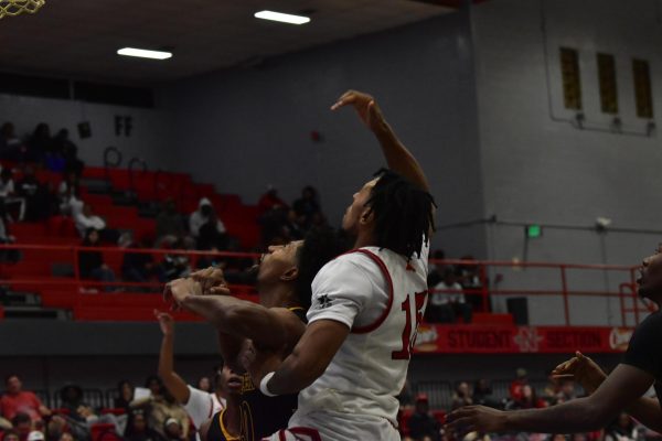 Nicholls Jamal West Jr. [#15] attempting a layup against Southeastern 12/5/2024