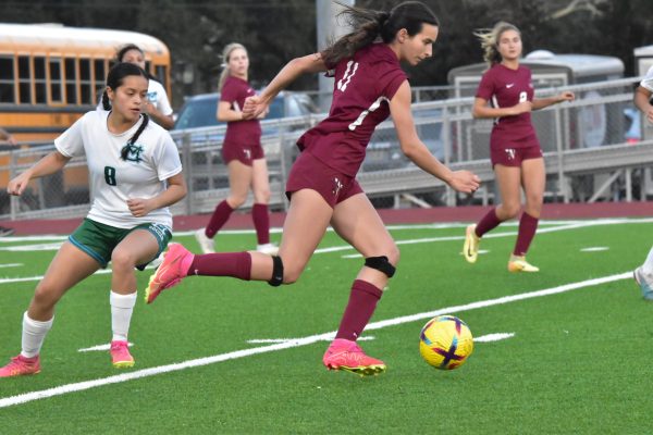 E.D. White #11 races past a Morgan City defender