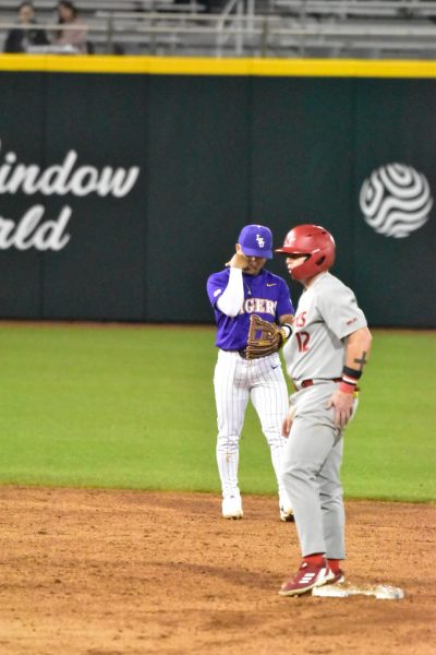 Nicholls first baseman Tyler Johnson (#12) stands on second base next to LSU shortstop Steven Milam (#4) in a game at Alex Box Stadium in Baton Rouge on Feb 24, 2025