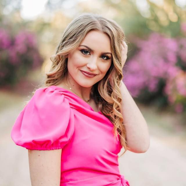 Alaina Ashmun smiles as she poses for a still shot outside of Nicholls State University