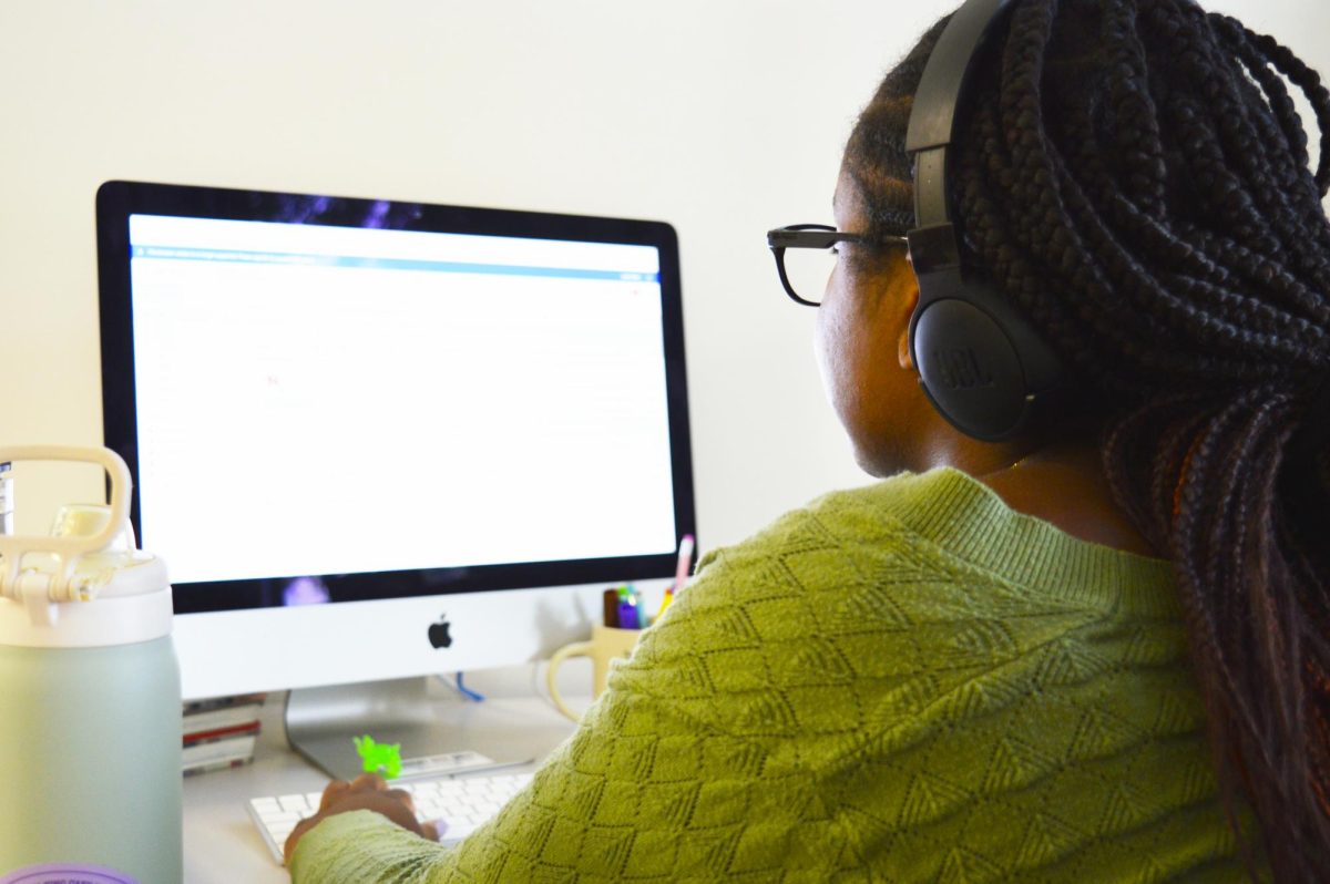 Sydney Hubbard checks her emails in her office.