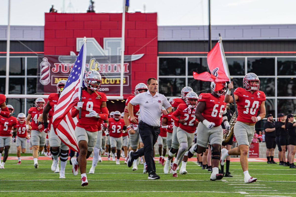 Colonels run onto the field.