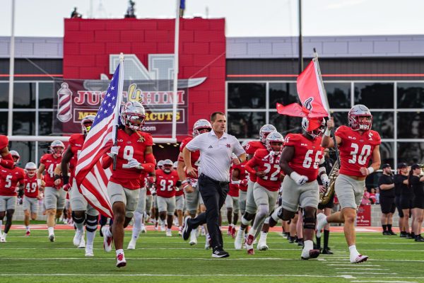 Colonels run onto the field.