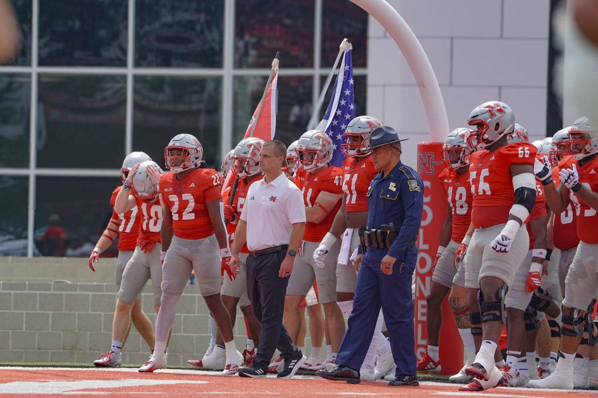 Coach Rybacki and team make their way to the field.