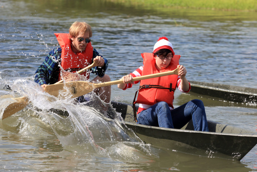 Ethan Pitre, art senior from Cutoff, and Koryn Boyd, art freshman from Pointe aux Chenes, paddle their pirogue during the annual Homecoming pirogue races.