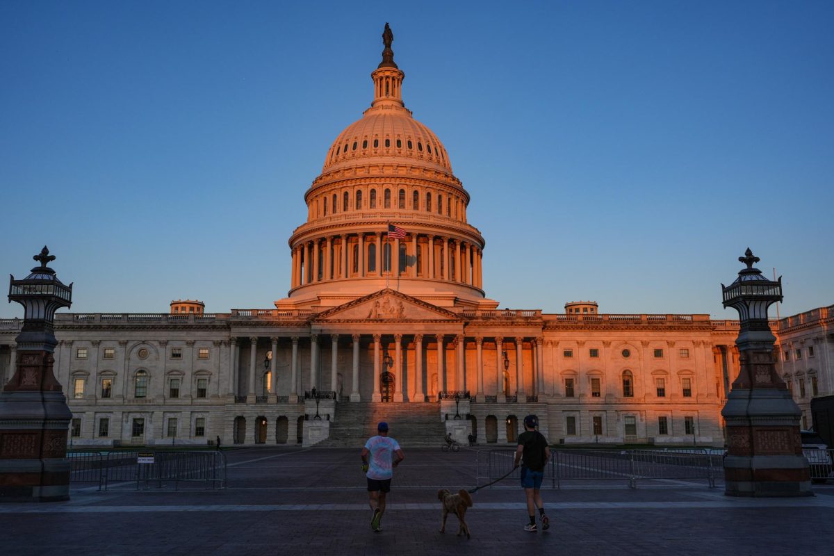 The Capitol is illuminated at dawn on the 6th day of the government shutdown, at the Capitol in Washington, Monday, Oct. 6, 2025.